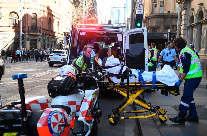 A woman injured during the attack is taken to hospital. 