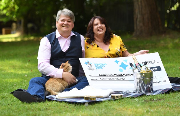 Newly-minted lottery millionaires Andrew and Paula Hancock - with Shortcake 