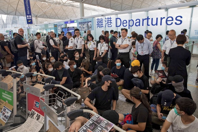 Protesters stage a sit-in protest in the departures area of Hong Kong's international airport on Tuesday.