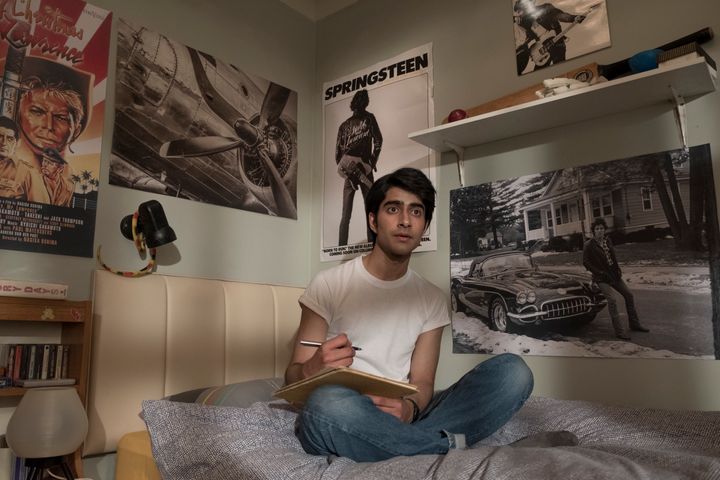Javed, played by Viveik Kalra, writes poetry in his room while inspired by Bruce Springsteen. 