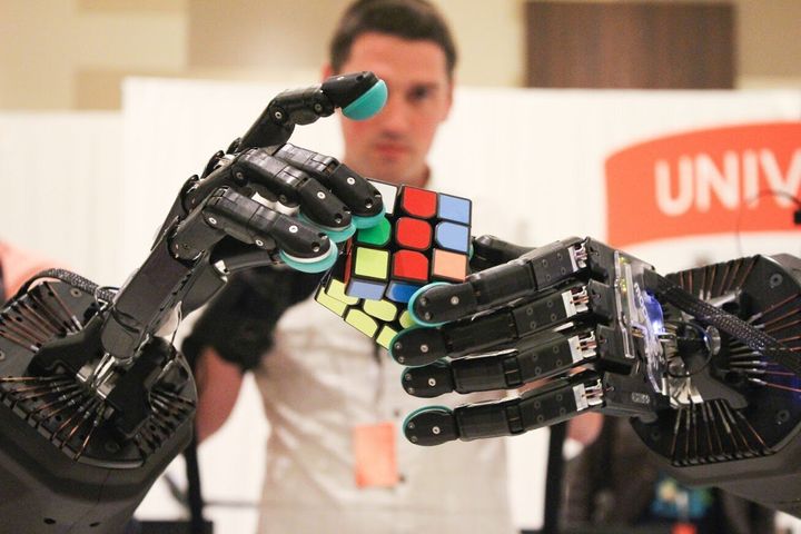 A pair Shadow Robot Company hands attempts to solve a Rubix Cube. The company is facing a number of obstacles posed by a possible no-deal Brexit.