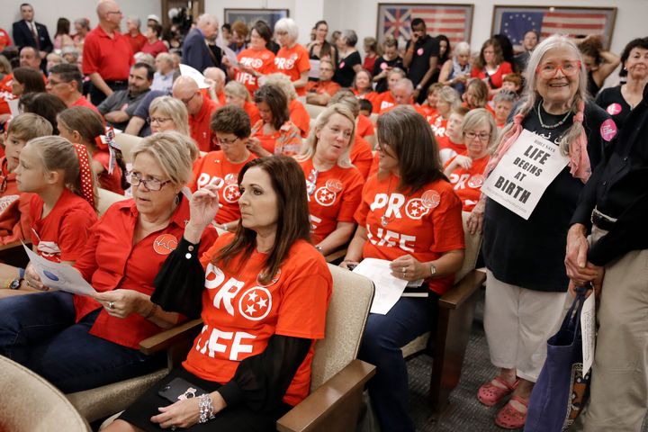 People wait for a Senate hearing to begin to discuss a fetal heartbeat abortion ban, or possibly something more restrictive, Monday, Aug. 12, 2019, in Nashville, Tenn. 