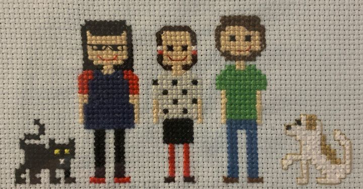 A cross-stitch of the author, her best friend and her best friend's husband (and their pets).