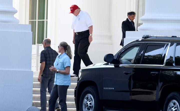 President Donald Trump, in golf attire, departs the White House for the drive to his Trump National Gold Club in Sterling, Virginia, July 14, 2019.