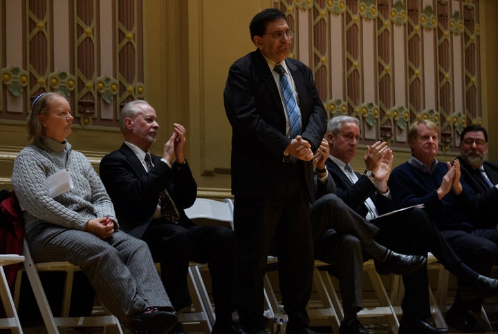 Lay cantor Cheryl Klein of Dor Hadash (left), Rabbi Jeffrey Myers of Tree of Life and Rabbi Jonathan Perlman of New Light Congregation are honored during an Oct. 28 memorial service in Pittsburgh.