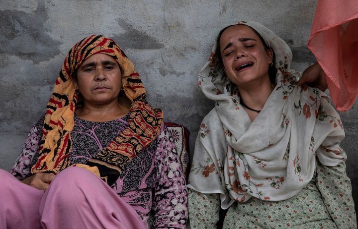Bilquis, sister of Irfan Ahmad Hurra, cries as their mother Jameela looks on, while they remember Irfan inside their house in Pulwama, August 13, 2019.