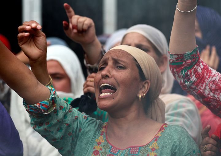 A woman shouts slogans during a protest in Srinagar August 14, 2019.
