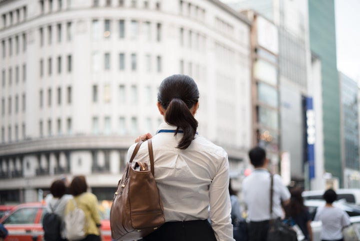 businesswoman's outdoor image in Ginza, a famous commercial district of Tokyo, photographed naturally without heavy processing