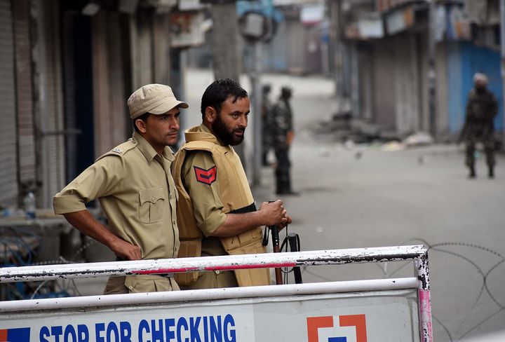 Policemen stand alert during the official celebration of India's Independence day in Srinagar,Kashmir on August 15, 2019. 