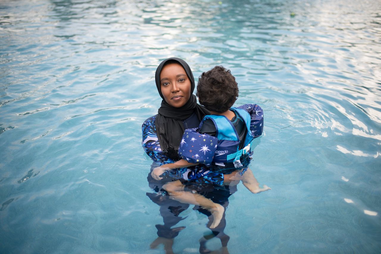 Fousia Abdullahi seems with her child at her home in Texas. 