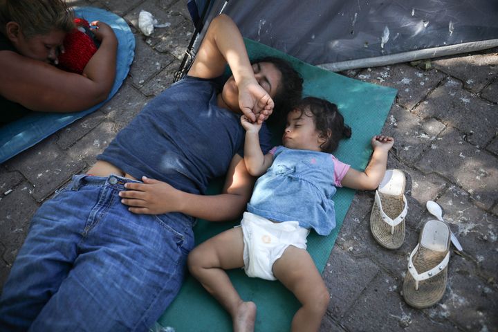 Migrants rest near a Mexican immigration center in Matamoros, Mexico. Turning Mexican border cities into waiting rooms for asylum seekers may be the Trump administration’s most forceful response yet to a surge of migrants, many of them Central American families.