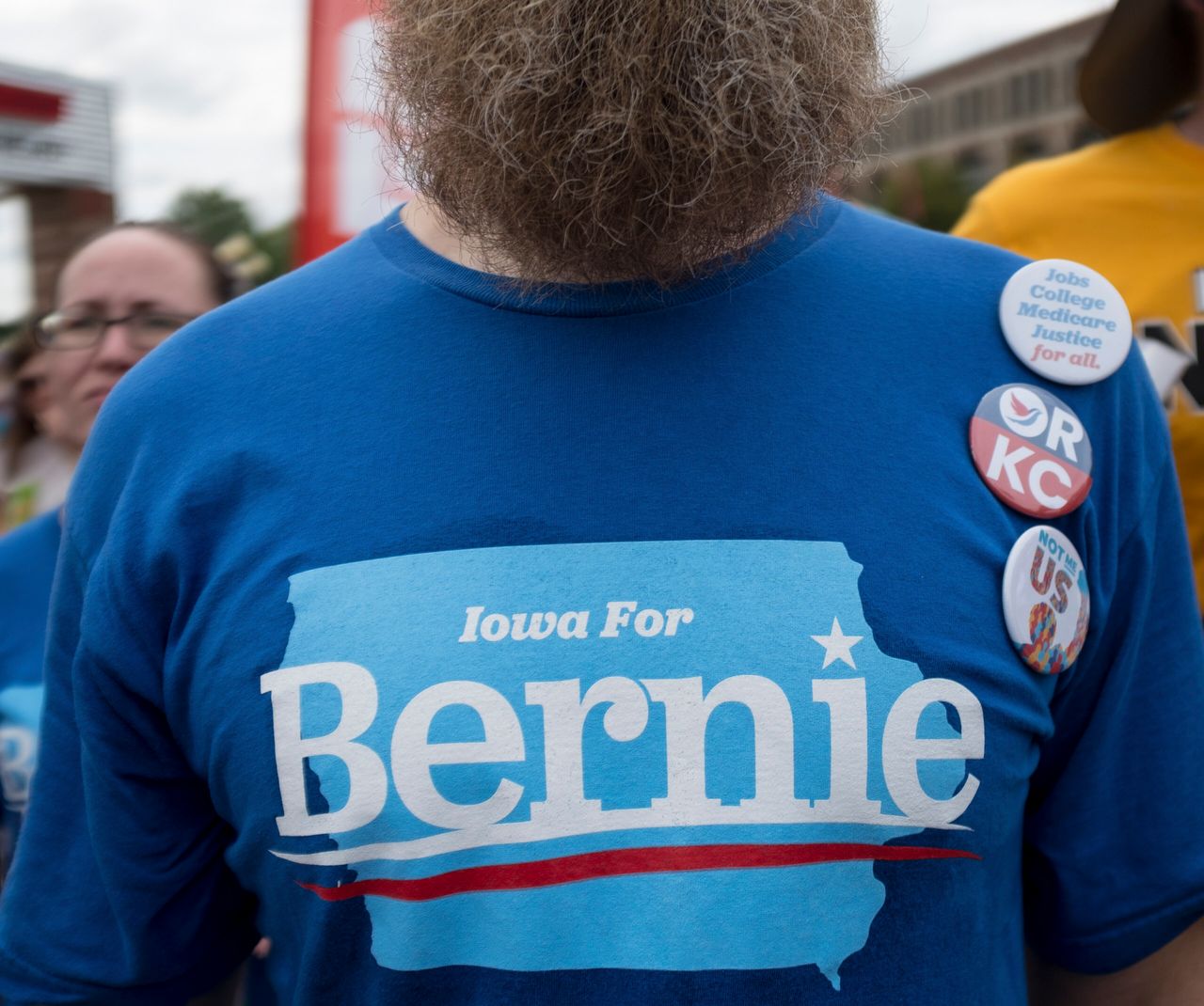 A Bernie Sanders supporter listens as the Vermont senator speaks at the Iowa State Fair on Aug. 11, 2019.