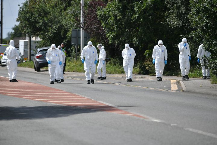 Police search the scene, where Thames Valley Police officer Pc Andrew Harper, 28, died following a "serious incident".