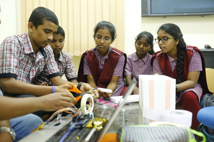 Students from a TSWREIS school working on the Swaerosat 1 payload.