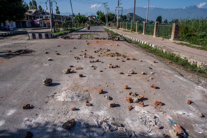 Stones thrown by Kashmiri protesters at security forces lie in the road in the Habba Kadal after a protest against revocation of Article 370 and Article 35A, on August 18, 2019 in Srinagar.