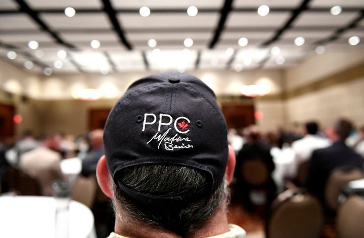A ball cap with the logo of the People's Party of Canada and signature of leader Maxime Bernier is seen on an attendee during the PPC national conference in Gatineau, Que. on Aug. 18, 2019.
