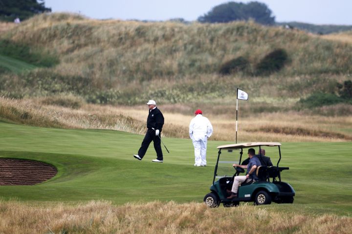 President Donald Trump walks off the 4th green while playing at Turnberry golf club in Turnberry, Scotland, on July 14, 2018.