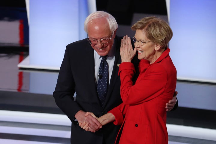 Sanders and Warren greet each other at the start of the Democratic presidential debate last month in Detroit.<i></i>