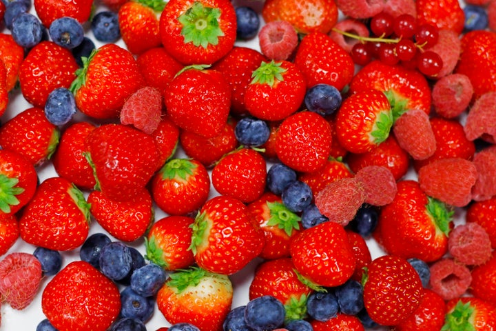 assorted fresh mix berries close up shot, berry's included strawberry, raspberries, blue berries and red currant