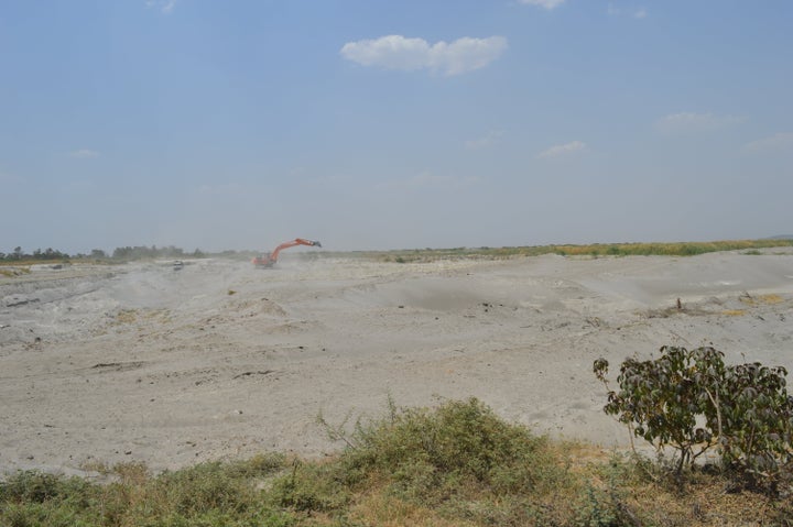 Fly ash from the pond is air borne and settles on fields and houses of Varegaon.