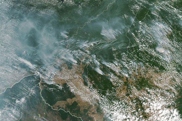 Plumes of white smoke above Brazilian states and Bolivia (bottom left) 