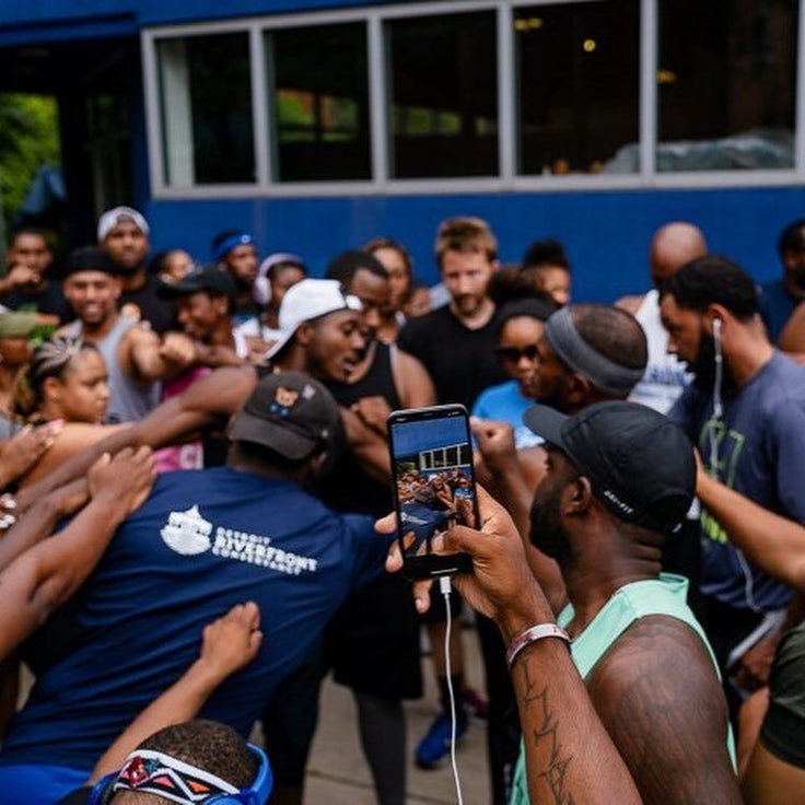 The running club brings it in for their call: "We run Detroit. We run Detroit. We run 313!” 