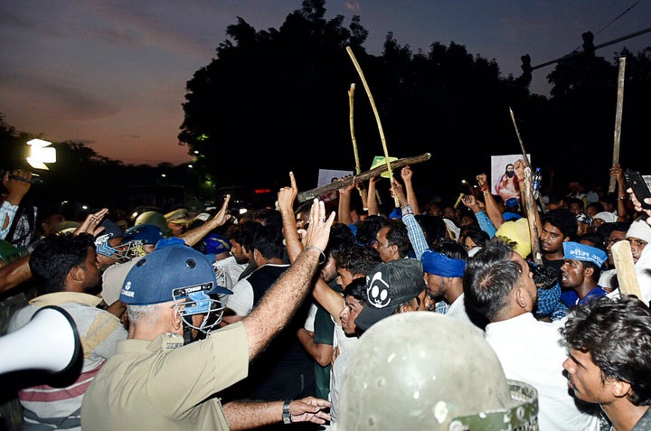 A clash between protesters and police personnel after the protest against the demolition of Sant Ravidas Temple, outside the premises of the temple, at Tughlakabad Extension on August 21, 2019 in New Delhi. 