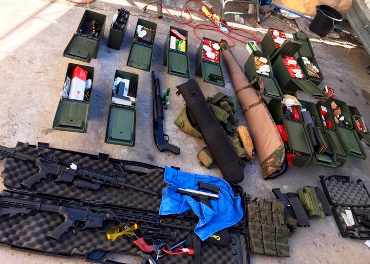 This undated photo released Wednesday, Aug. 21, 2019 by the Long Beach, Calif., Police Department shows weapons and ammunitio