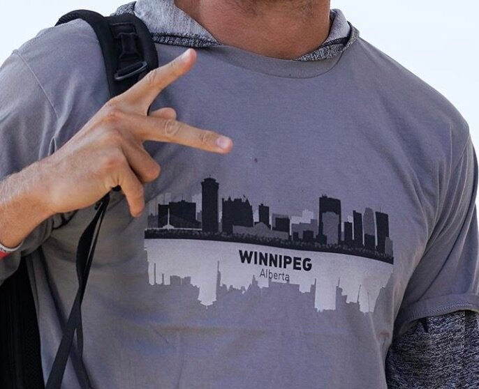 A close-up view of AJ Cole III's shirt that mysteriously says "Winnipeg, Alberta."