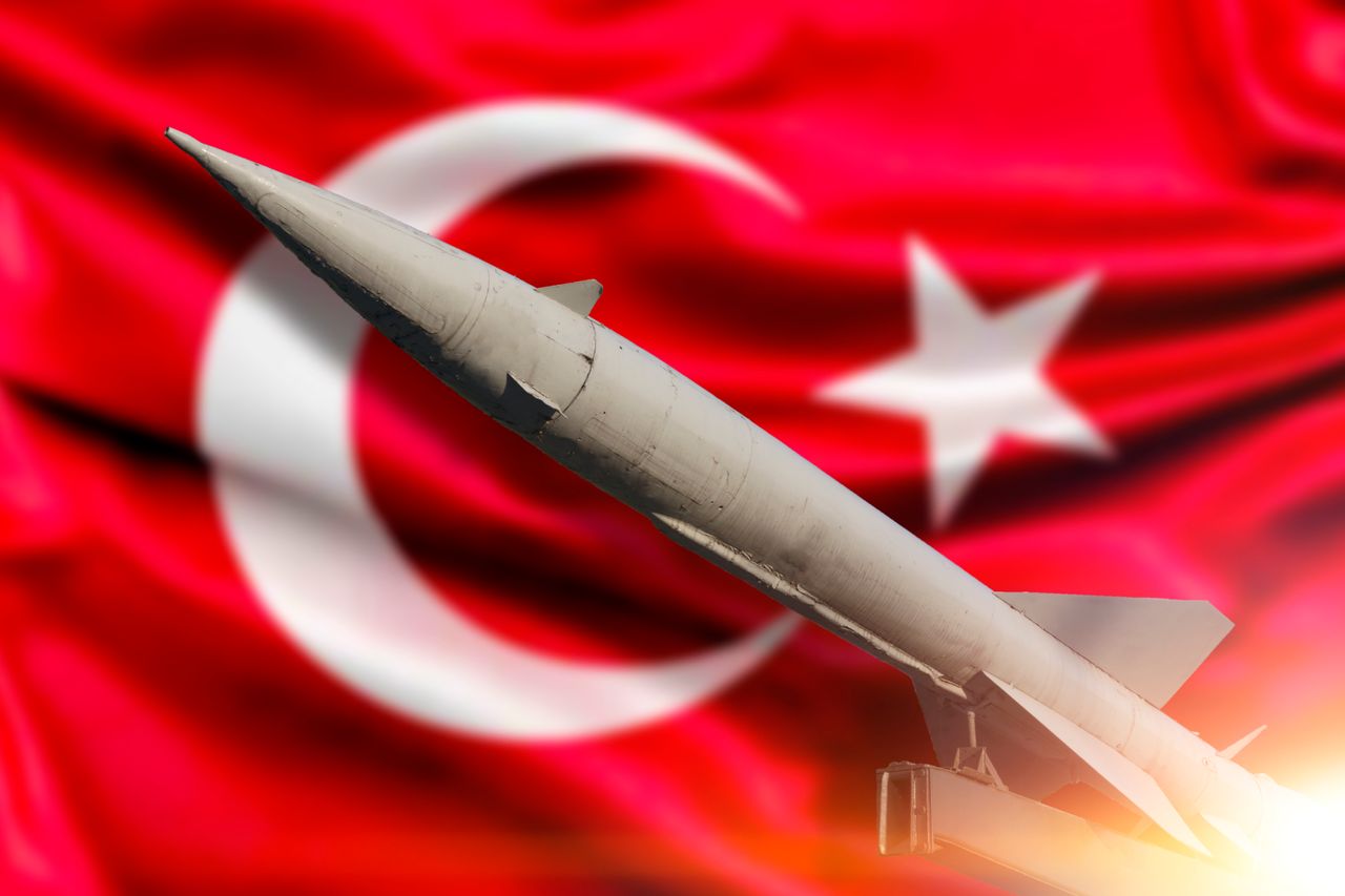 Rocket on the background of the flag of Turkey. Warhead missile