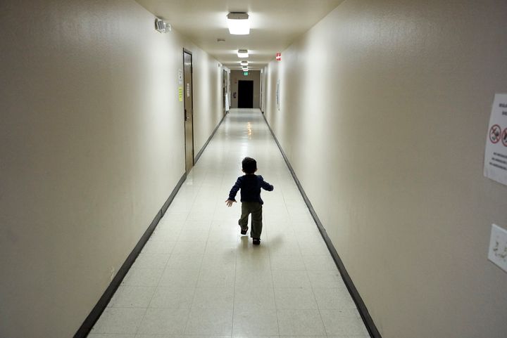In this Dec. 11, 2018, file photo, an asylum-seeking boy from Central America runs down a hallway after arriving from an immigration detention center to a shelter in San Diego.