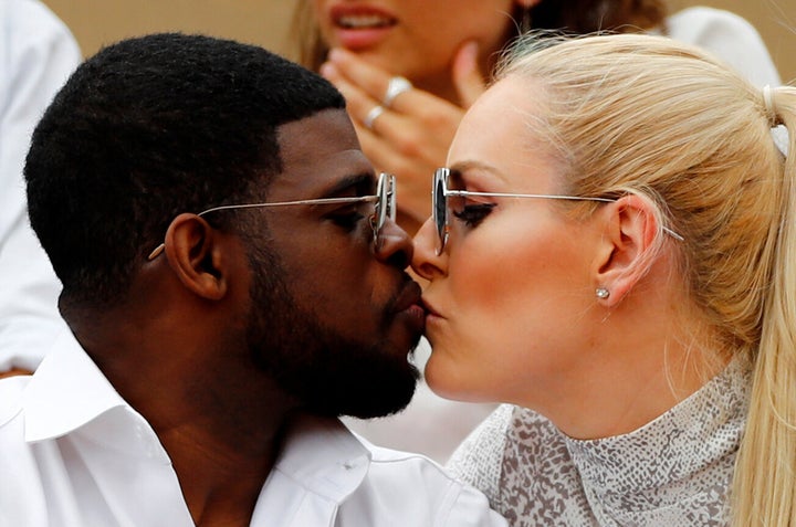 The couple steal a kiss at the French Open in June 2019 [Insert joke here about the score being love-love]. 