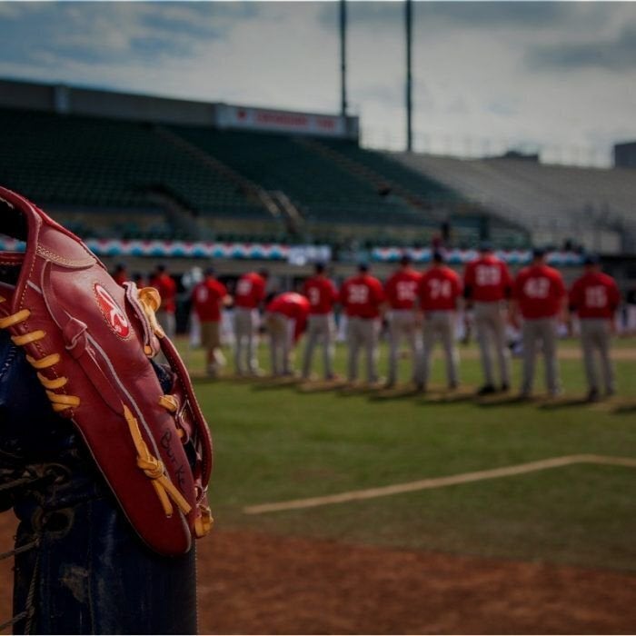 Players line up at the beginning of an 85-hour baseball game in Edmonton Aug. 22.