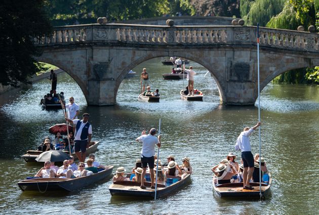 People punt along the River Cam in Cambridge, as the heatwave continues throughout the long weekend.