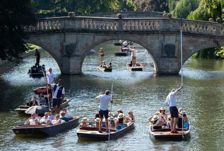People punt along the River Cam in Cambridge, as the heatwave continues throughout the long weekend.