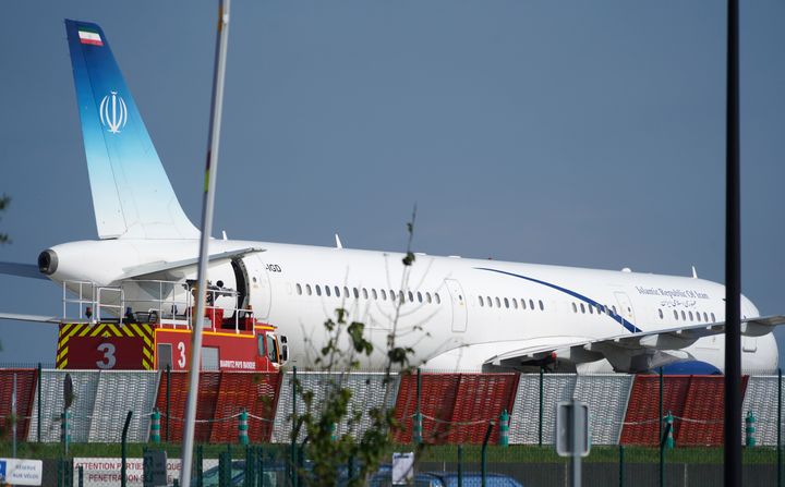 Aan Iranian plane can be seen at the airport in Biarritz, France Sunday, Aug. 25, 2019. Iranian Foreign Minister Mohammad Javad paid an unannounced visit Sunday to the G-7 summit and headed straight to the building where leaders of the world's major democracies have been debating how to handle the country's nuclear ambitions. 