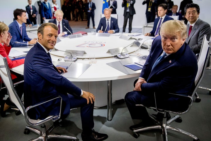 French President Emmanuel Macron, center left, and President Donald Trump, center right, participate in a G-7 Working Session on the Global Economy, Foreign Policy, and Security Affairs the G-7 summit in Biarritz, France, on Sunday.