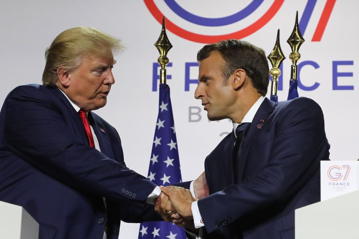 French President Emmanuel Macron shakes Trump's hands during a joint press conference in Biarritz on Monday.