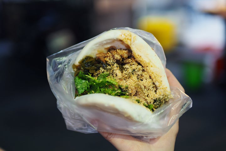 Pork belly gua bao made with a traditional Taiwanese steamed bun and stewed pork belly.