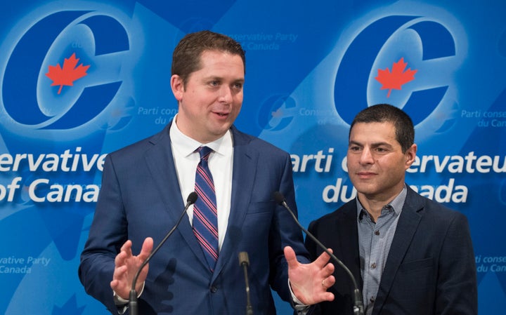 Conservative Leader Andrew Scheer and his Quebec lieutenant Alain Rayes speak to reporters in Saint-Hyacinthe, Que. on May 13, 2018.