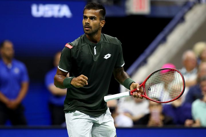 Sumit Nagal celebrates winning the first set against Roger Federer during their Men's Singles first round match on day one of the 2019 US Open.