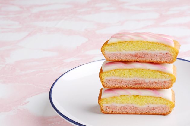 closeup three slices of english angel cake on a white plate