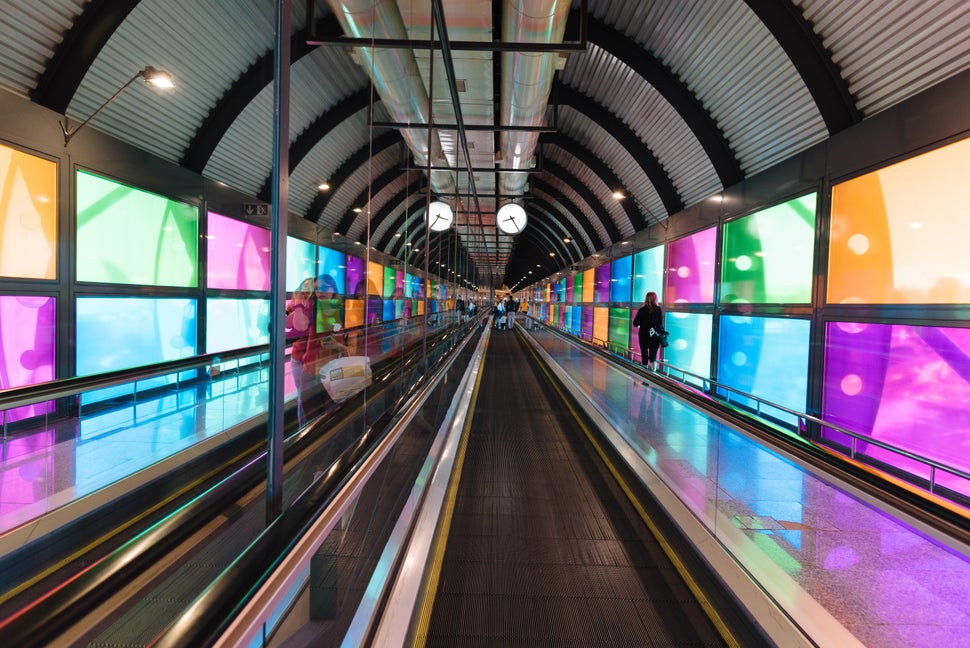 Madrid, Spain - June 20, 2018: Futuristic architecture mechanical corridor in Barajas - Adolfo Suarez Airport