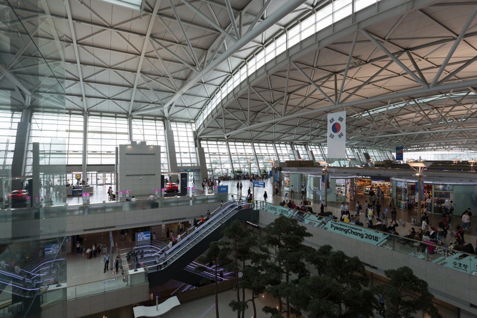 Incheon, Korea - September 11, 2017: People at Incheon International Airport in South Korea. It is the largest airport in South Korea, the primary airport serving the Seoul Capital Area, and one of the largest and busiest airports in the world.