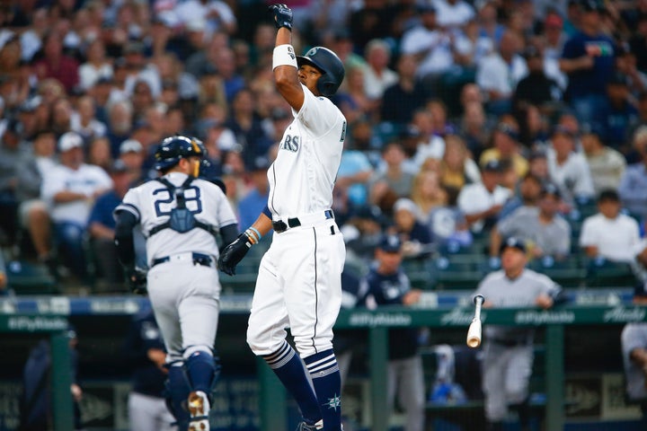 SEATTLE, WA - AUGUST 26: Keon Broxton #4 of the Seattle Mariners throws his bat after striking out to end the second inning, leading to an ejection after hitting home plate umpire Manny Gonzalez with a batting glove as he threw them behind him in the second inning against the New York Yankees at T-Mobile Park on August 26, 2019 in Seattle, Washington. (Photo by Lindsey Wasson/Getty Images)