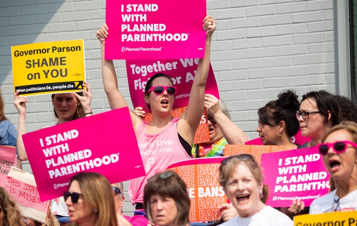 Pro-choice supporters and staff of Planned Parenthood hold a rally outside the Planned Parenthood Reproductive Health Services Center in St. Louis, Missouri, May 31, 2019, the last location in the state performing abortions. - A US Court on May 31, 2019 blocked Missouri from closing the clinic. (Photo by SAUL LOEB / AFP) (Photo credit should read SAUL LOEB/AFP/Getty Images)