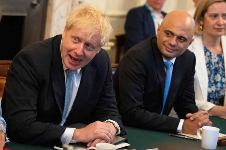 Sajid Javid (centre) and Amber Rudd with Prime Minister Boris Johnson as he holds his first Cabinet meeting at Downing Street in London.