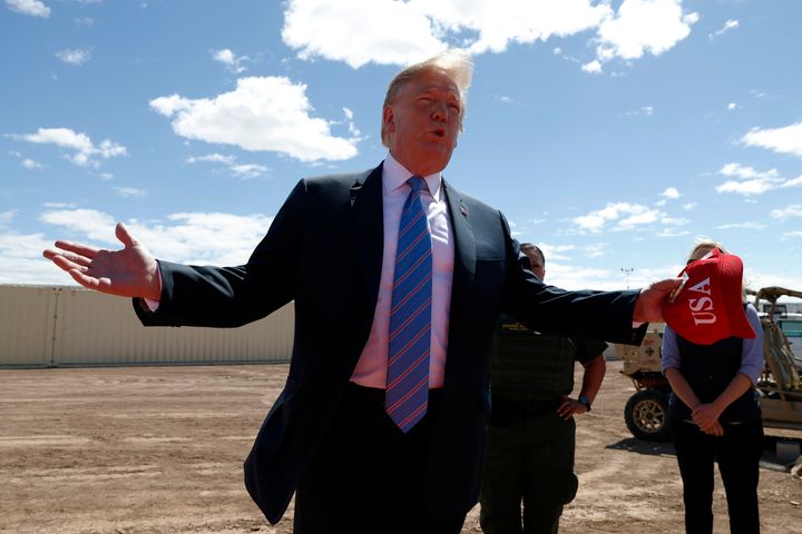 President Donald Trump visits a section of the border barrier in Calexico, Calif., on April 5.