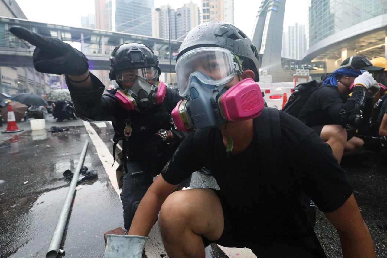 Demonstrators have a discussion during a clash with riot police during an anti-extradition protest in Hong Kong, China August 25, 2019. REUTERS/Ann Wang