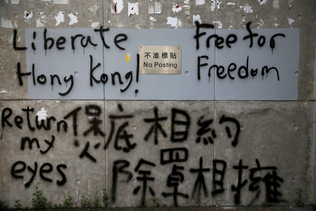 The wall of a building of the Central Government Offices is prayed with slogans in Hong Kong, August 20, 2019. 
